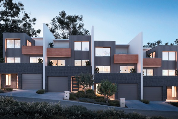 Melbourne’s property market 2024, we’re seeing the rising popularity of townhouse and apartment living. Image shows a row of 4 three-level townhouses with garages and front door on the lower level and two levels above. 